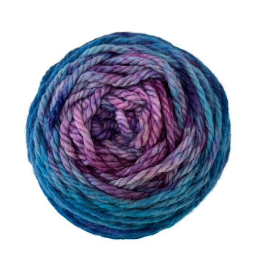 Top view of hand-dyed yarn multicolored blue, light blue, purple, cobalt, orchid. 